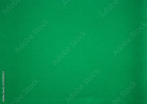 Photo of a green texture made of felt fabric.Green background for text. Horizontal blank sheet of green paper.