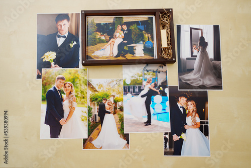 printed wedding photos and a wooden box with a flash drive. 