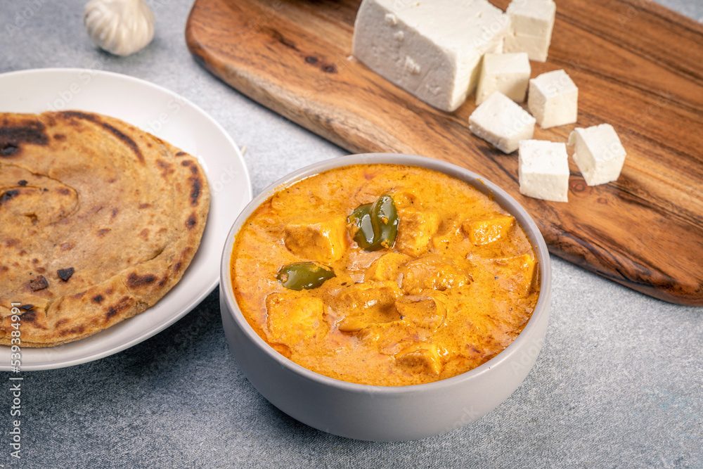 Kadai Paneer is a spicy, flavourful and delicious gravy dish made with  paneer, bell pepper, and onion in a freshly ground spice and served with chappati or lachcha parantha