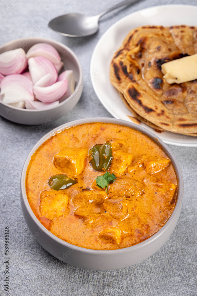 Kadai Paneer is a spicy, flavourful and delicious gravy dish made with paneer, bell pepper, and onion in a freshly ground spice and served with chappati or lachcha parantha Kadai Paneer is a spicy, flavourful and delicious gravy dish made with paneer, bell pepper, and onion in a freshly ground spice and served with chappati or lachcha parantha