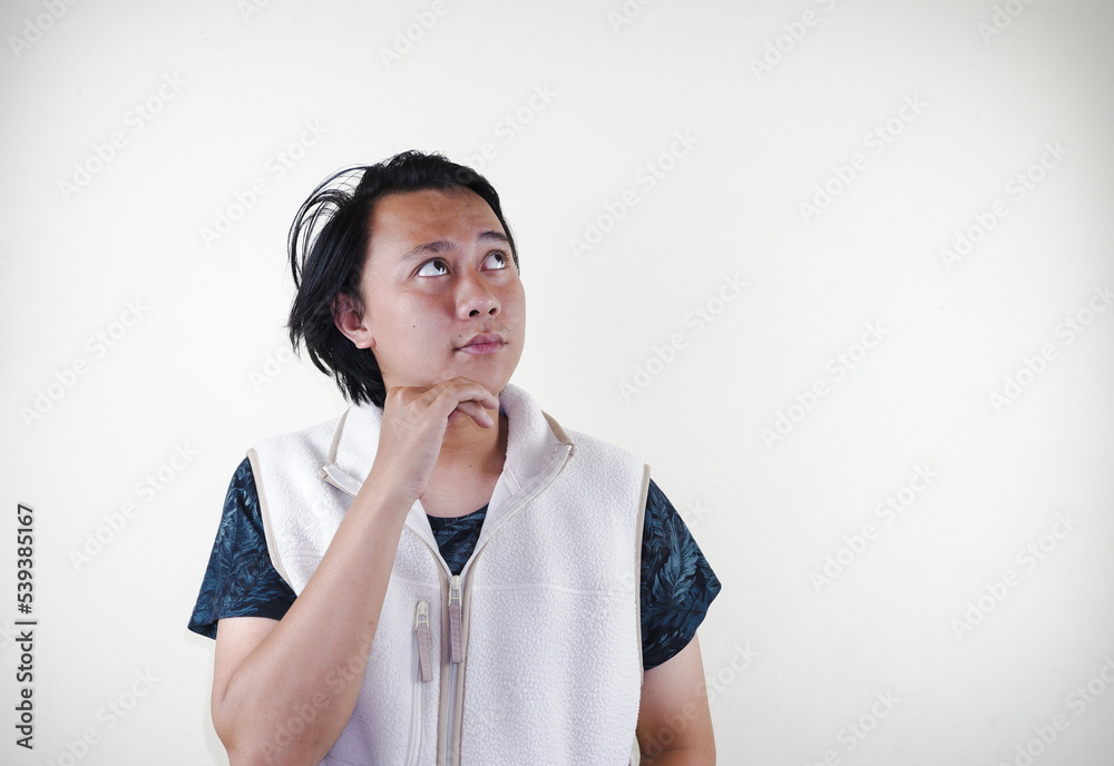 portrait of young asian man thinking isolated on white background portrait of young asian man thinking isolated on white background