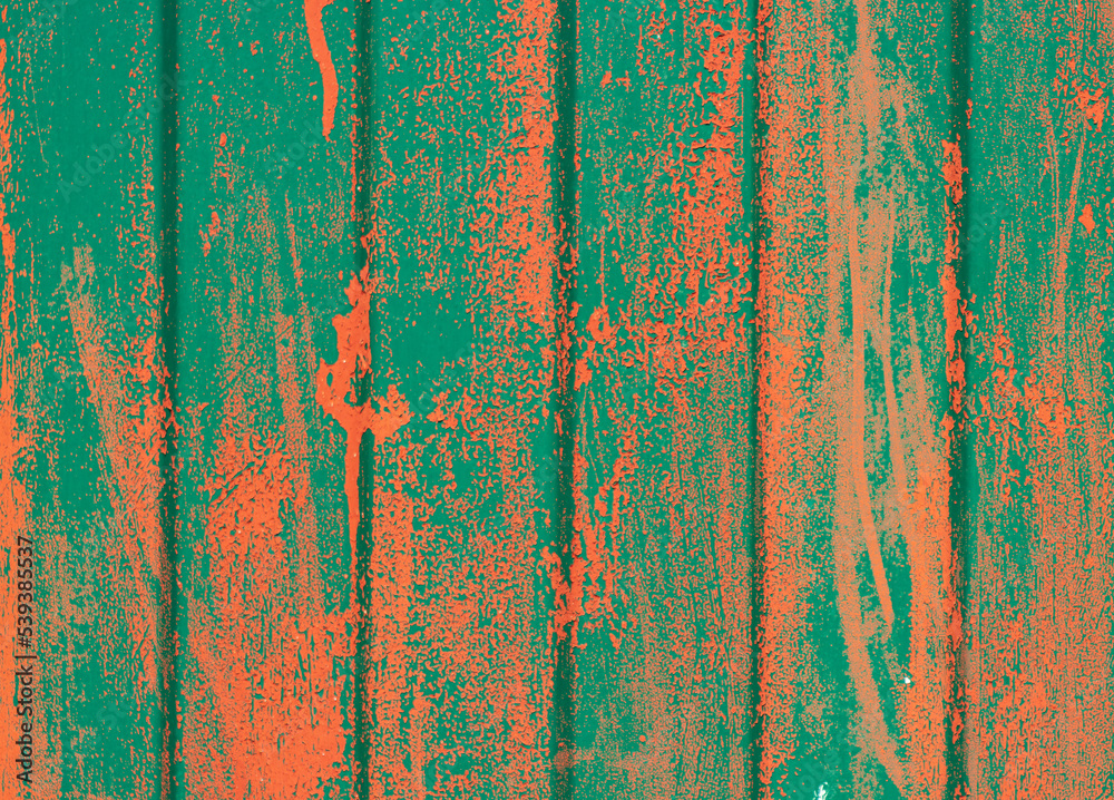 green fence with splashes of orange paint as a background