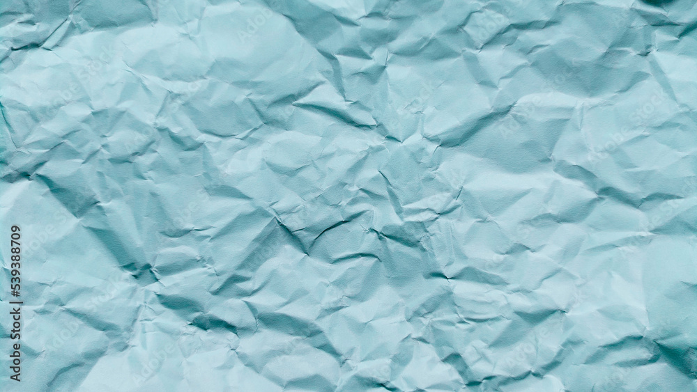 Fototapeta premium crumpled paper texture background with blue color