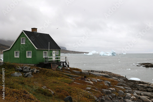 House on the coast of Qeqertarsuaq, Greenland, Denmark   photo