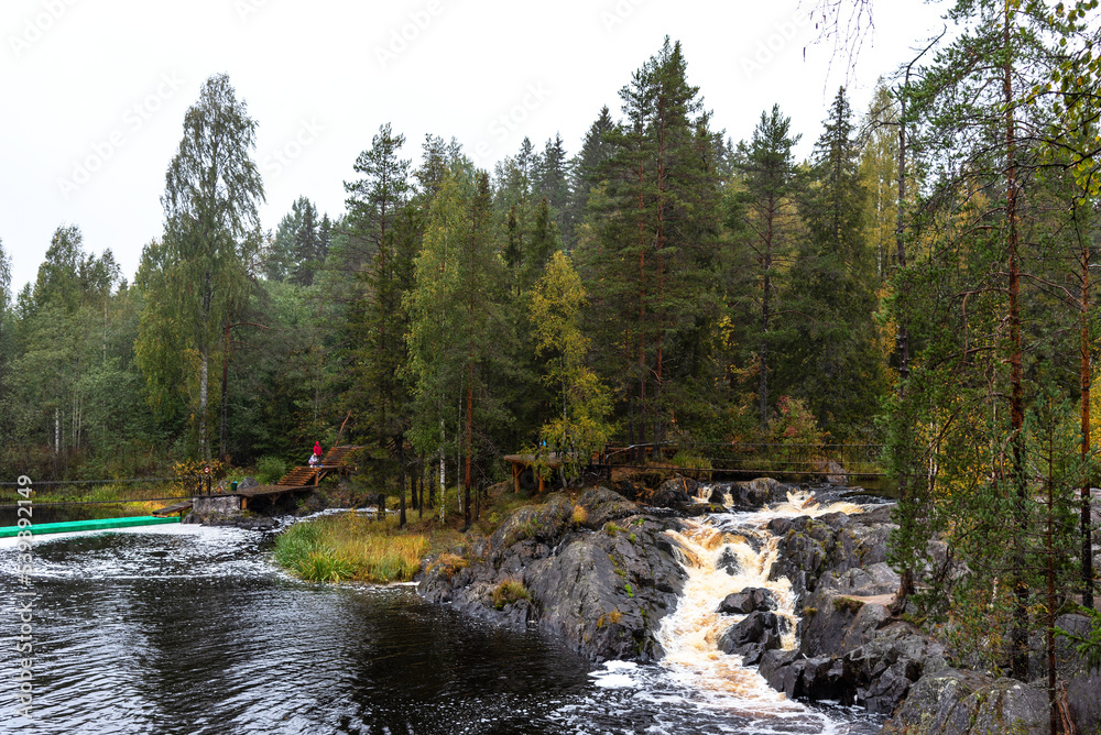 Picturesque waterfall in Ruskeala in autumn, Karelia, Russia Picturesque waterfall in Ruskeala in autumn, Karelia, Russia