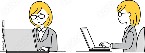 パソコンを操作する眼鏡のビジネスウーマン