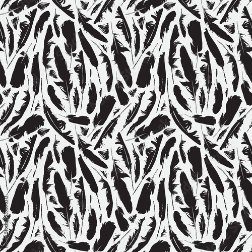 Monochrome seamless pattern with scattered bird feathers. Black raven feathers on a white backdrop. Abstract vector background with disheveled plumelets. Wallpaper, wrapping paper or fabric design