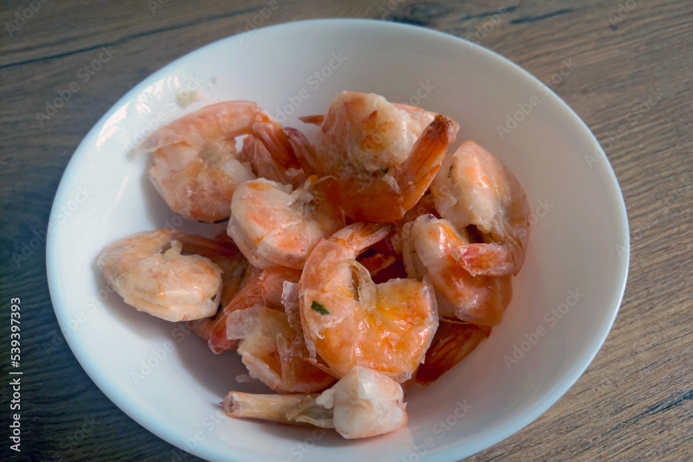 Cooked delicious shrimp in a white plate. Cooked delicious shrimp in a white plate.