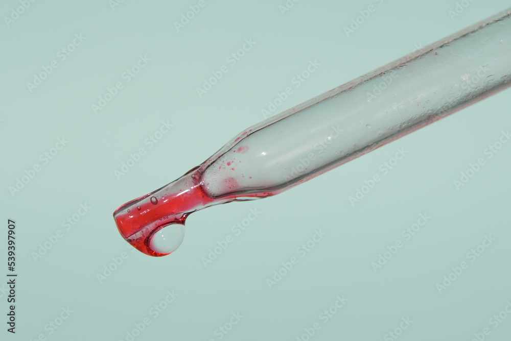The last drop in the pipette of blood. The concept of developing a pharmaceutical drug for the treatment of diseases with the help of drugs that improve DNA. High quality photo The last drop in the pipette of blood. The concept of developing a pharmaceutical drug for the treatment of diseases with the help of drugs that improve DNA. High quality photo