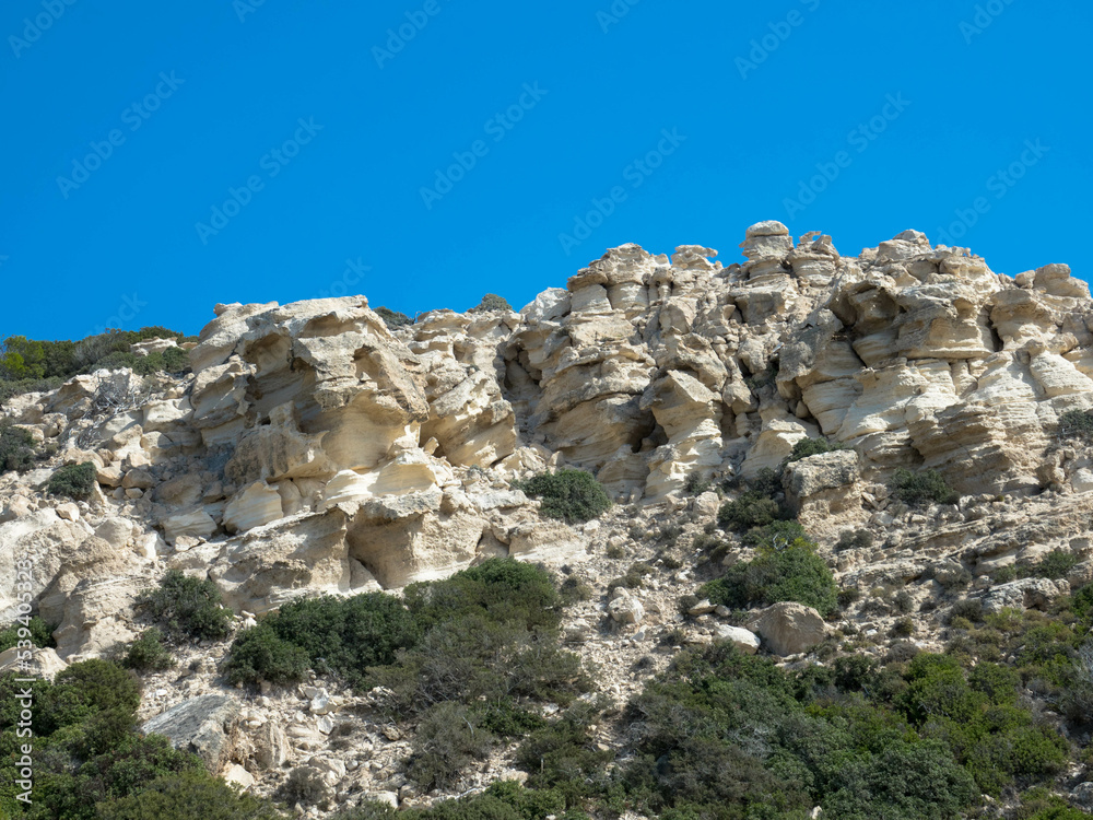 Fototapeta premium Spectacular panorama view of the bizarre rock formation on top of the Attavyros mountain. The highest mountain on the island of Rhodes. Embonas, Rhodes Island, Greece. Plenty space for text.