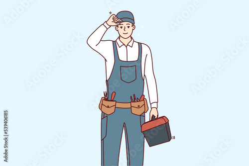 Smiling young maintenance worker in uniform with tools in hands. Happy male repairman or mechanic with box of instruments and equipment. Vector illustration. 