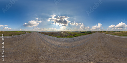 full seamless spherical hdri 360 panorama view on no traffic gravel road among fields with overcast sky and white clouds in equirectangular projection,can be used as replacement for sky in panoramas