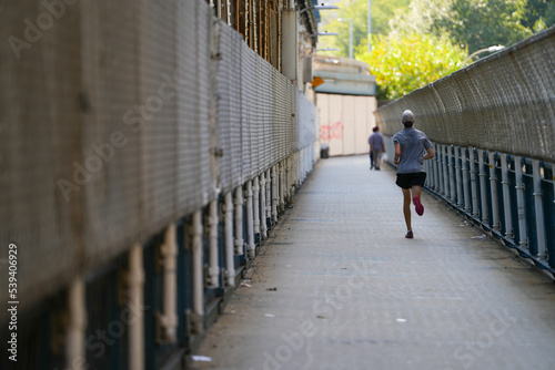 joking on Manhattan Bridge. photo during the day. sport.