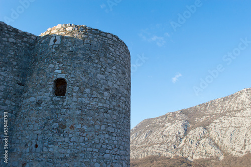 Medieval stone tower with small window, on the hill in Drivenik, Croatia