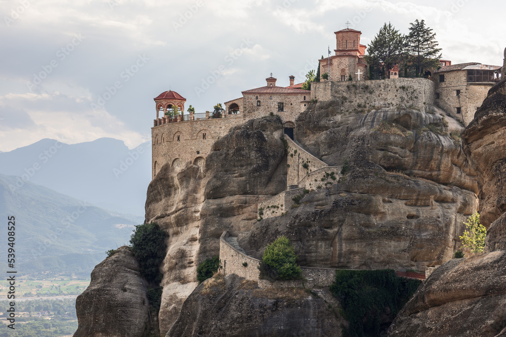 Panoramic terrace of the Holy Varlaam Monastery with a beautiful arched stone Byzantine-style gazebo, Meteora, Greece