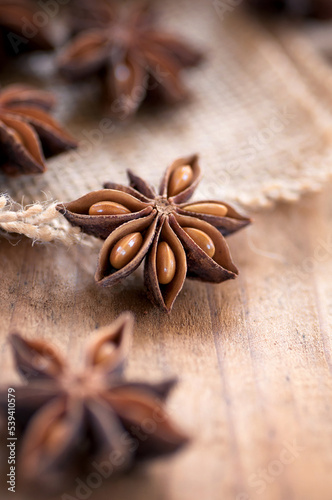 Anise stars on wooden surface