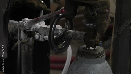 Cylinder valve. Gas bottling plant. 4K, UHD, 50p, Panning,Close-up, 