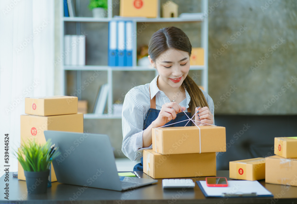 Asian teenager owner business woman work at home for online shopping and sale. Asian teenager owner business woman work at home for online shopping and sale.