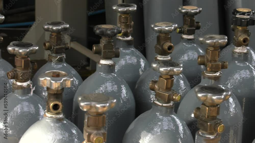 Cylinder valve. Gas bottling plant. 4K, UHD, 50p, Panning,Close-up, Cylinder valve. Gas bottling plant. 4K, UHD, 50p, Panning,Close-up,