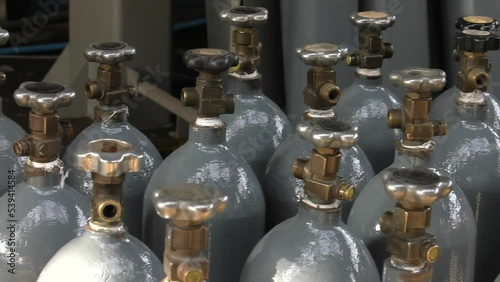 Cylinder valve. Gas bottling plant. 4K, UHD, 50p, Panning,Close-up, 