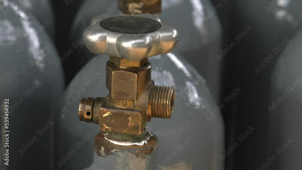 Cylinder valve. Gas bottling plant. 4K, UHD, 50p, Panning,Close-up, Cylinder valve. Gas bottling plant. 4K, UHD, 50p, Panning,Close-up,