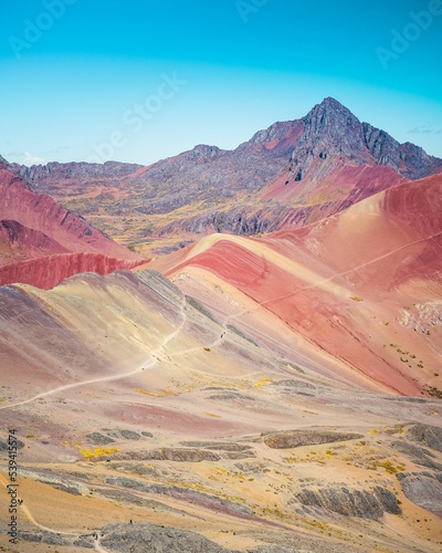 Vertical shot of the 7 colors Vinicunca mountains in Peru photo