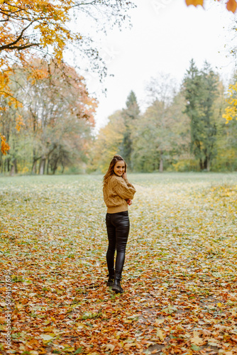 Woman walking in the autumn park  a healthy lifestyle  walk  exercise