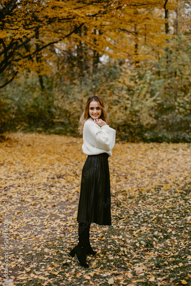 Woman walking in the autumn park, a healthy lifestyle, walk, exercise