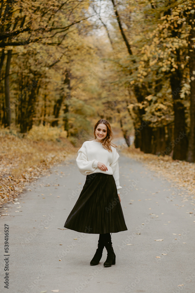 Woman walking in the autumn park, a healthy lifestyle, walk, exercise Woman walking in the autumn park, a healthy lifestyle, walk, exercise