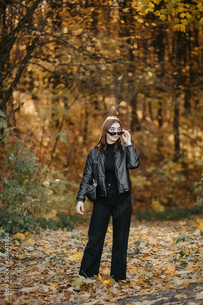Lovely couple posing in autumn forest, lovers walking in park. lovestory in forest Lovely couple posing in autumn forest, lovers walking in park. lovestory in forest