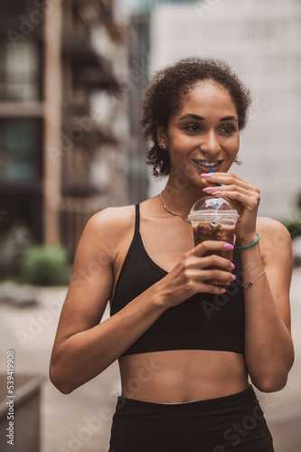 Slika na platnu Pretty young sportive girl with a cup of coffee