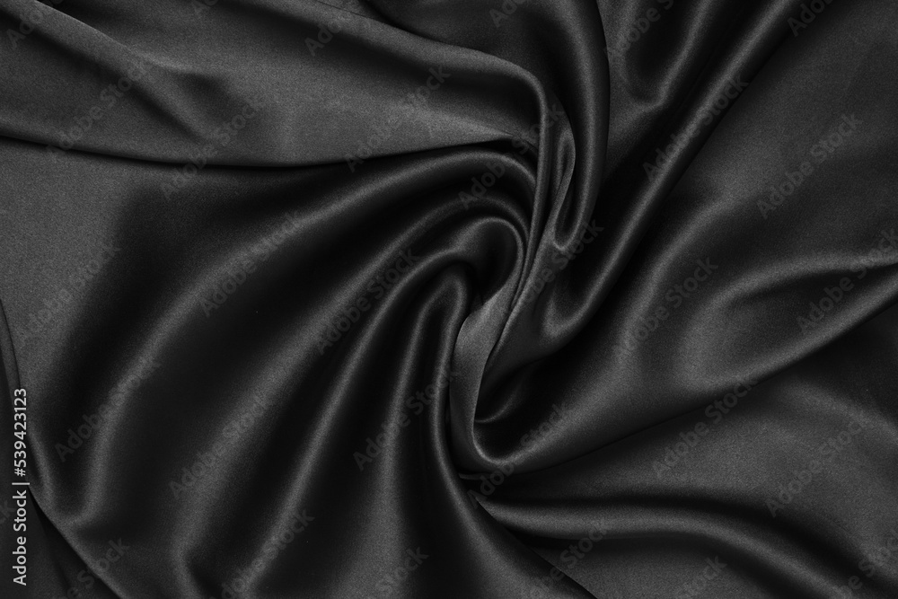 Obraz premium Black fabric texture background, wavy fabric slippery black color, luxury satin cloth texture.
