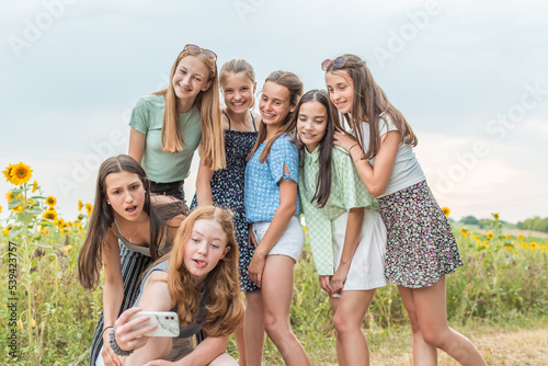Teenage girls take a selfie in summer
