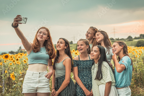 Teenage girls take a selfie in summer