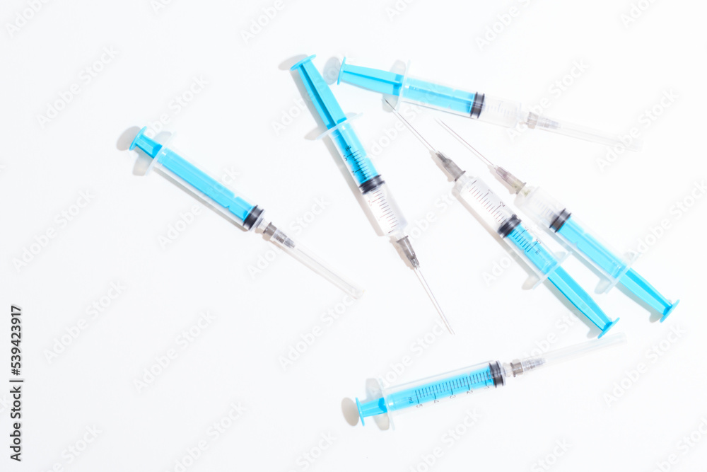 Disposable plastic syringe prepared for injection and vaccination in the hospital. The concept of medicine and health Disposable plastic syringe prepared for injection and vaccination in the hospital. The concept of medicine and health