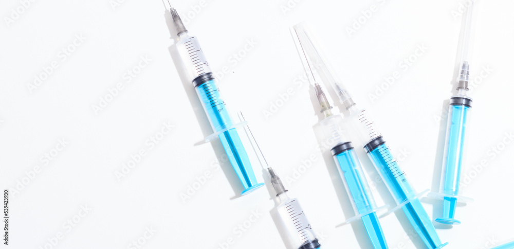 Disposable plastic syringe prepared for injection and vaccination in the hospital. The concept of medicine and health Disposable plastic syringe prepared for injection and vaccination in the hospital. The concept of medicine and health