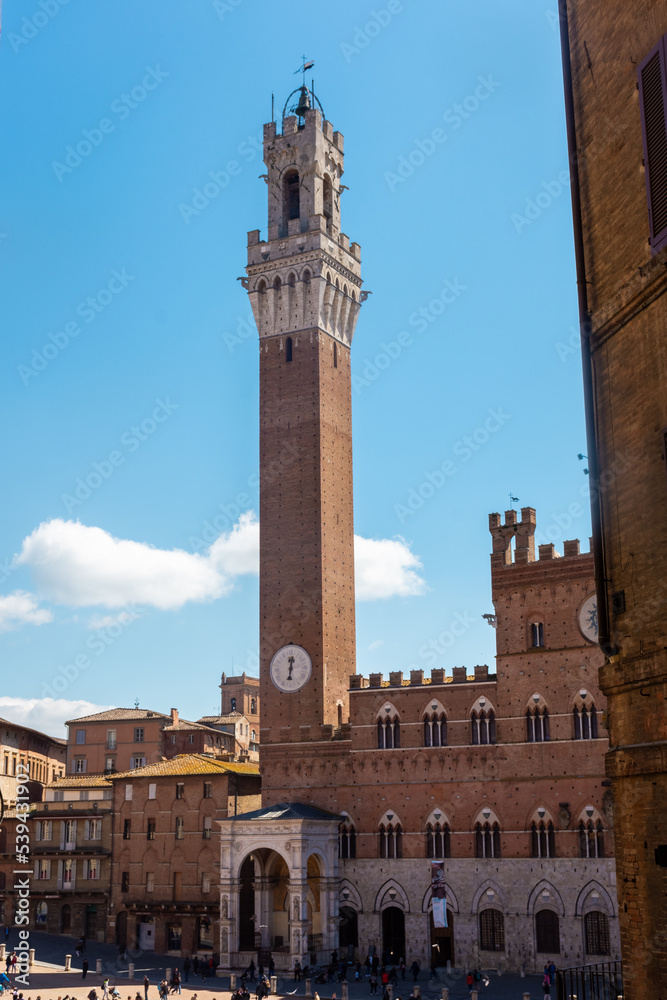 Tourists enjoy Piazza del Campo square in Siena, Italy. The historic centre of Siena has been declared by UNESCO a World Heritage Site.