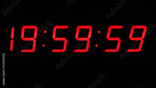 Obraz na płótnie Digital timer on a black background. Light panel with red numbers. 20 o'clock w salonie
