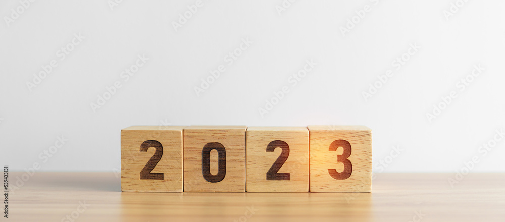 2023 year block on table background. goal, Resolution, strategy, plan, start, budget, mission, action, motivation and New Year concepts 2023 year block on table background. goal, Resolution, strategy, plan, start, budget, mission, action, motivation and New Year concepts