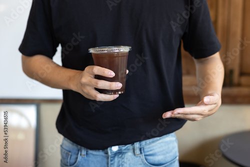 person with glass of coffee