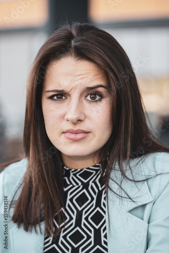 Gorgeus woman beaing confused about something photo