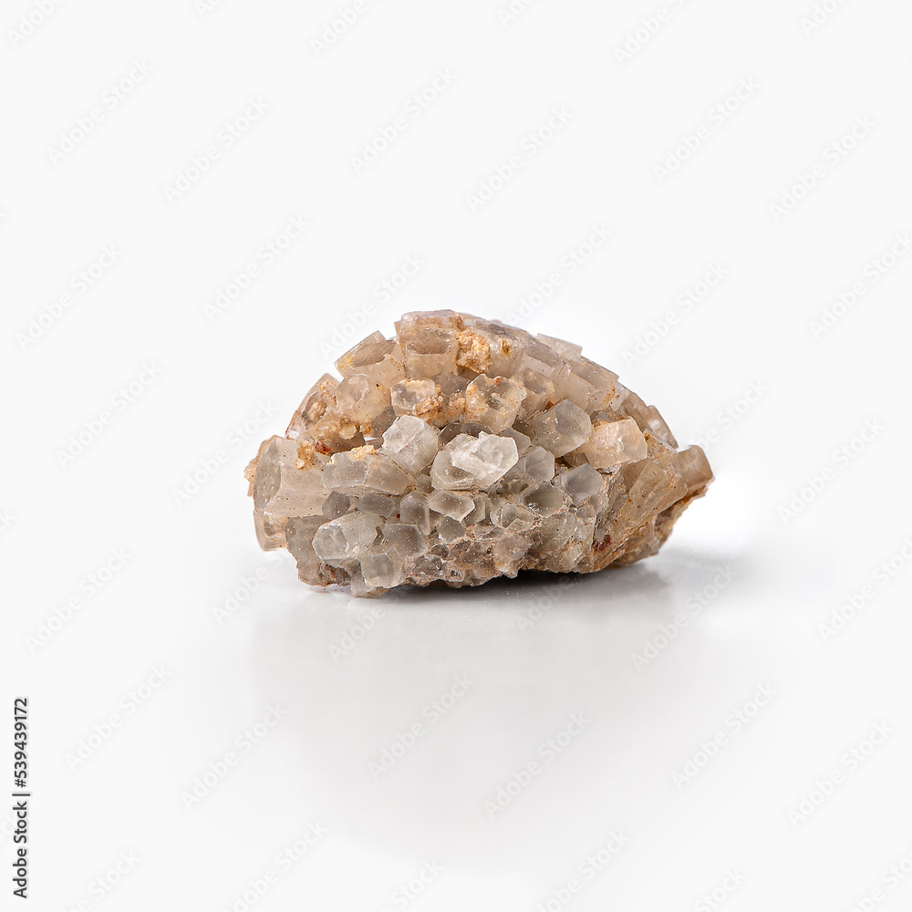 Raw aragonite crystal stone isolated on white background with reflection. Raw aragonite crystal stone isolated on white background with reflection.