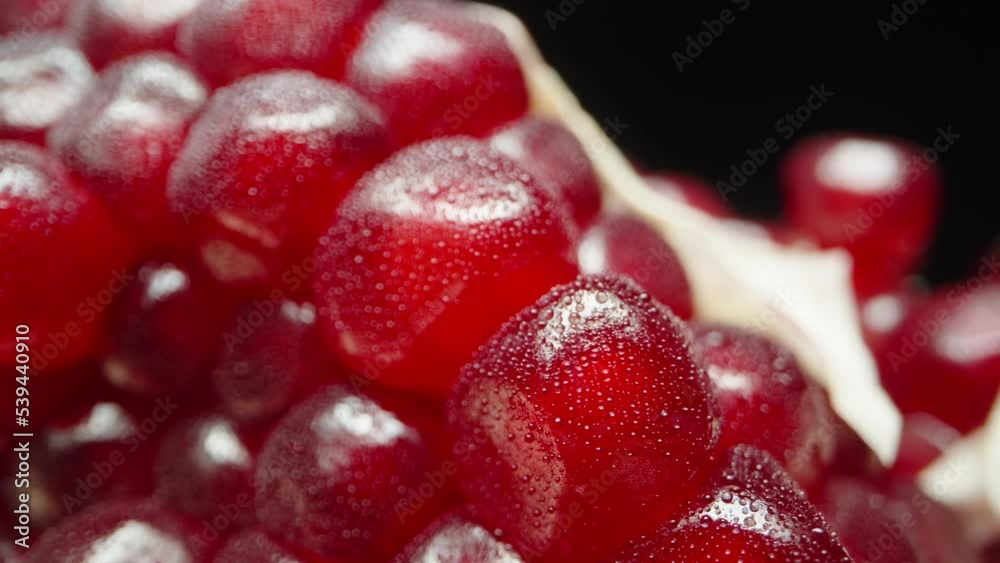 I stack the pomegranate slices in the background while the camera moves sideways. slider, extreme close-up.