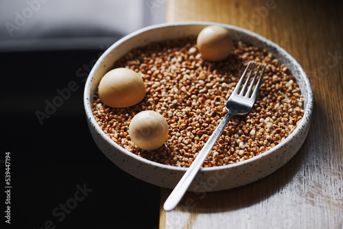 Fine dining plated dessert of popped buckwheat with salted caramel ice cream