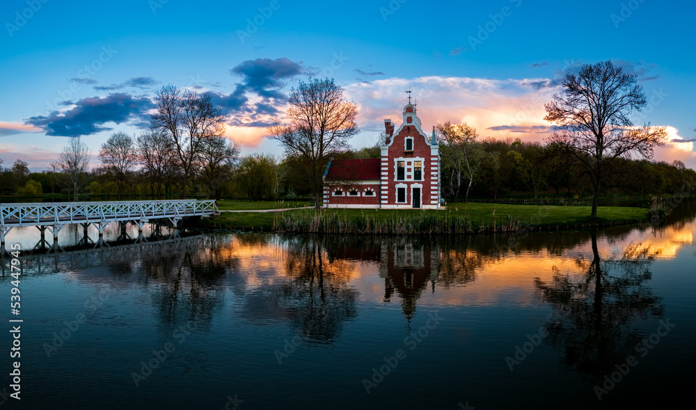 Dutch hous is a part of Festetics castle. in Deg town Hungary. Amazing little lake in this place. Fantastic mood green area, Dutch hous is a part of Festetics castle. in Deg town Hungary. Amazing little lake in this place. Fantastic mood green area,