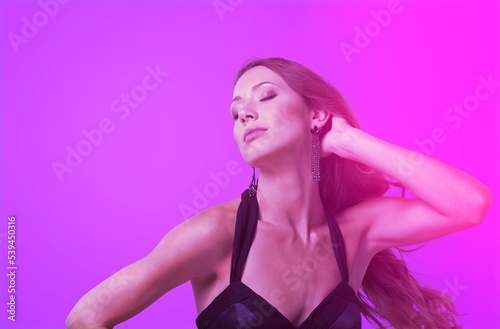 Happy girl model in neon posing