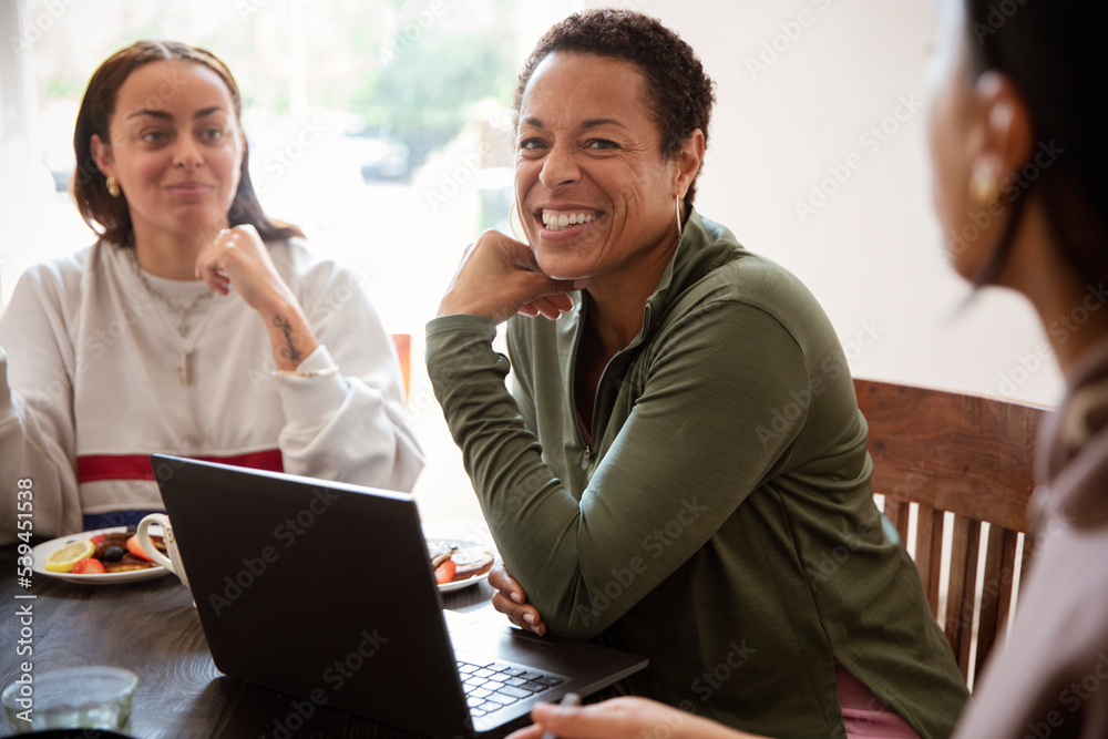 Happy mother and daughters at laptop Happy mother and daughters at laptop