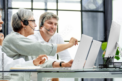 Call center agent with headset working on support hotline