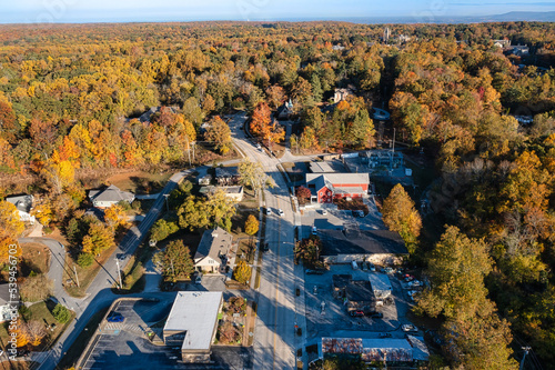 Aerial view of University Ave with a church and tower in the background, on a mountain top October day with beautiful autumn fall colorful foliage at the University of the South in Sewanee Tennessee. photo