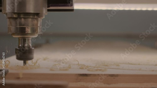 Milling machine with Computer numerical control processes wood blank at high speed.